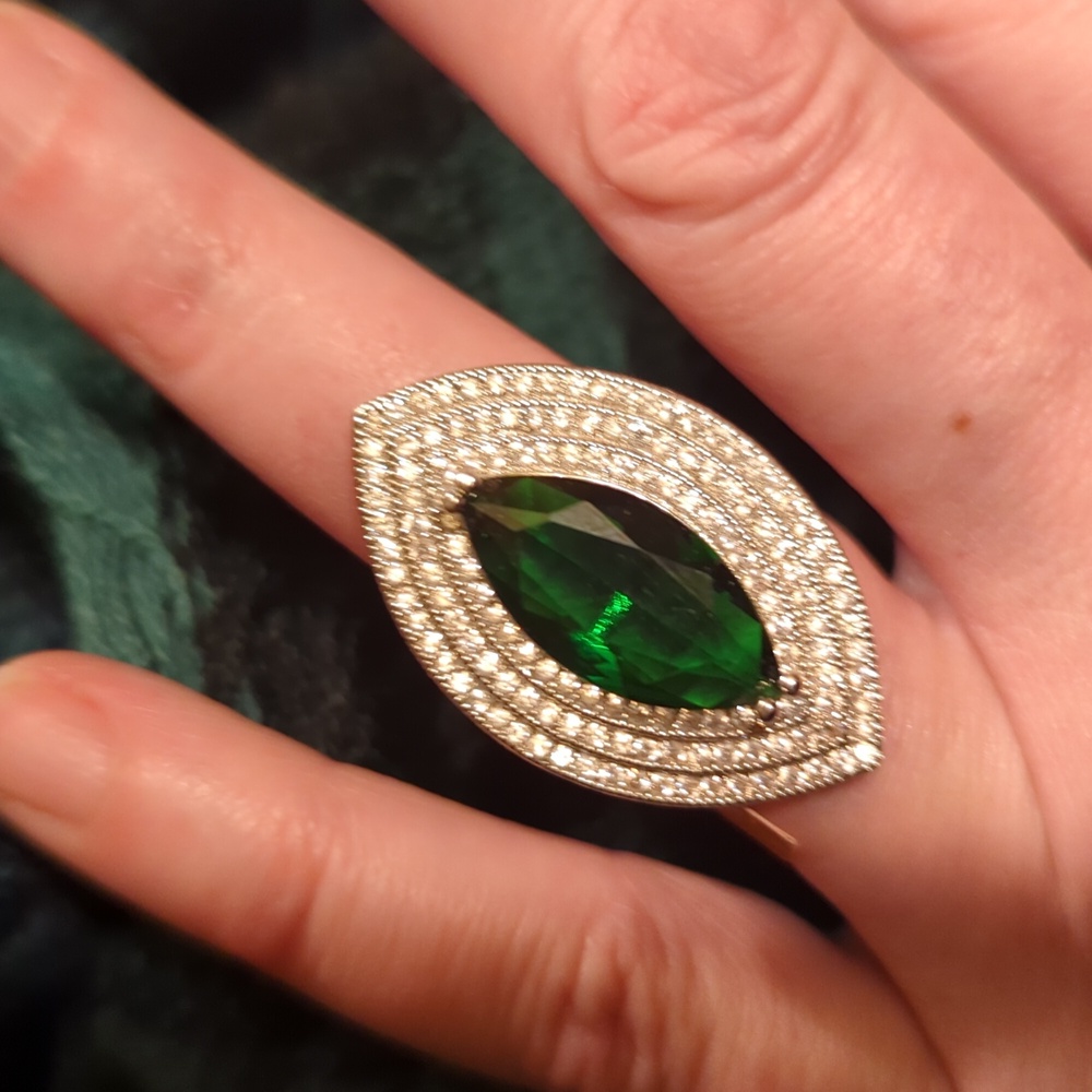 Ring, costume, marquis green stone with bright & shiny clear stones surrounding